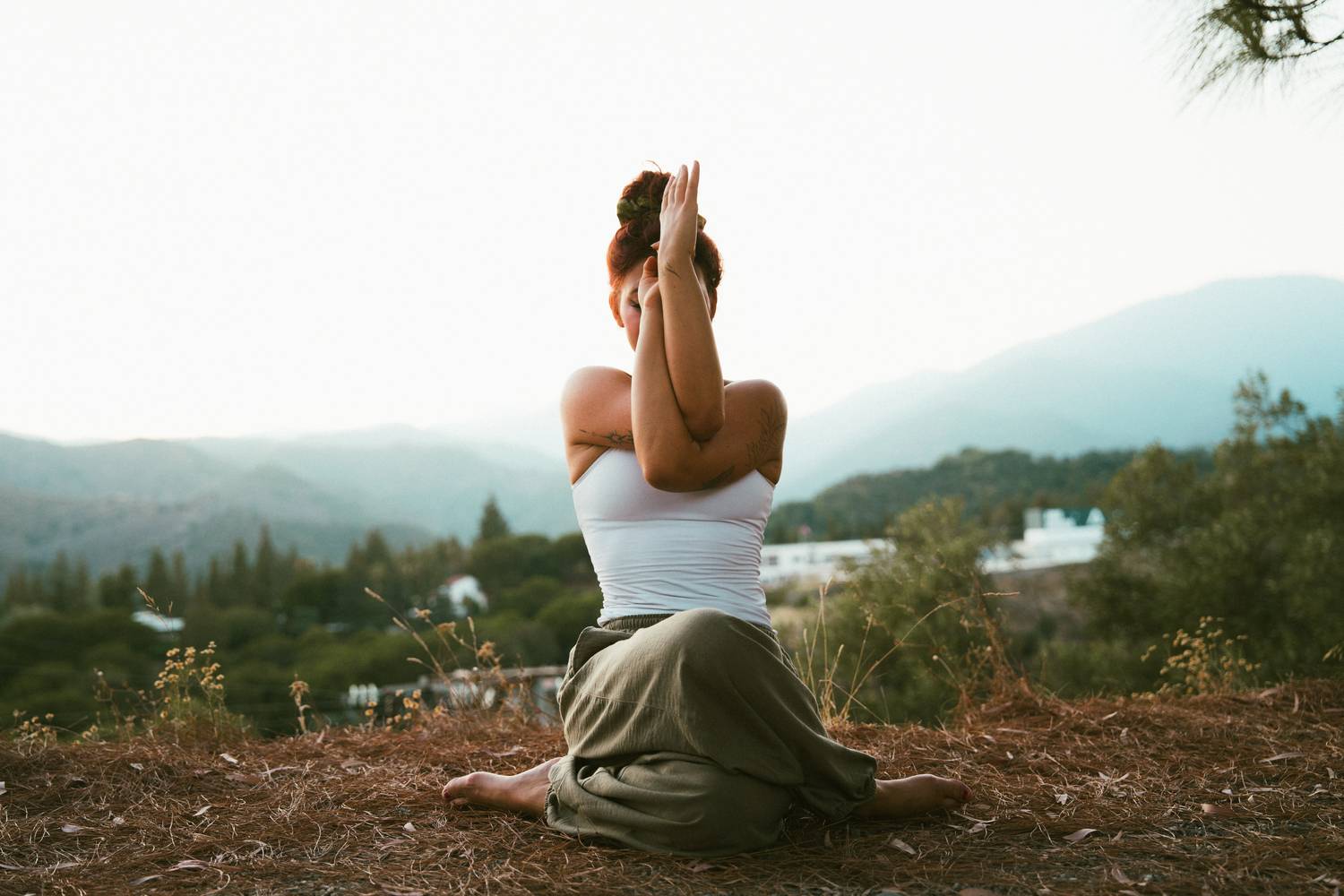 Rosa seated in meditation above the valley
